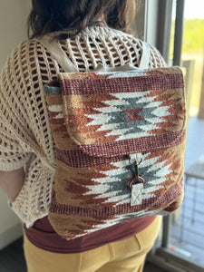 brown, rust + teal aztec woven backpack