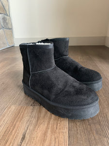 black fur-lined ultra mini platform boots