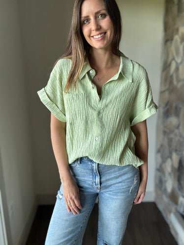 green short sleeve button down top