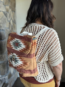 brown, rust + teal aztec woven backpack