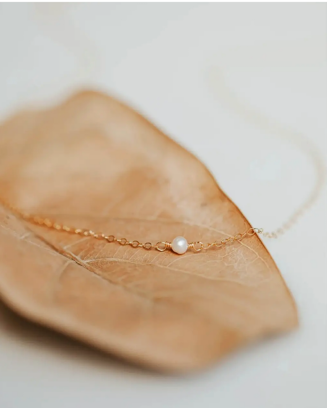 hello adorn tiny freshwater pearl necklace | gold + silver