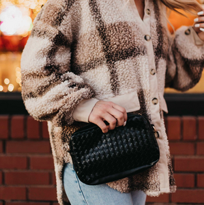 black woven crossbody camera bag