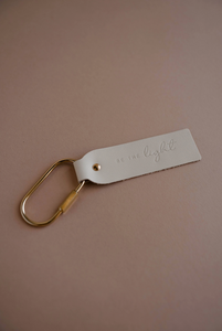 be the light blonde key fob keychain