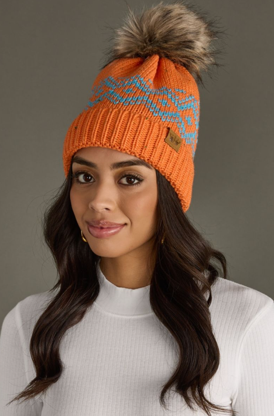 bright orange + blue pom beanie