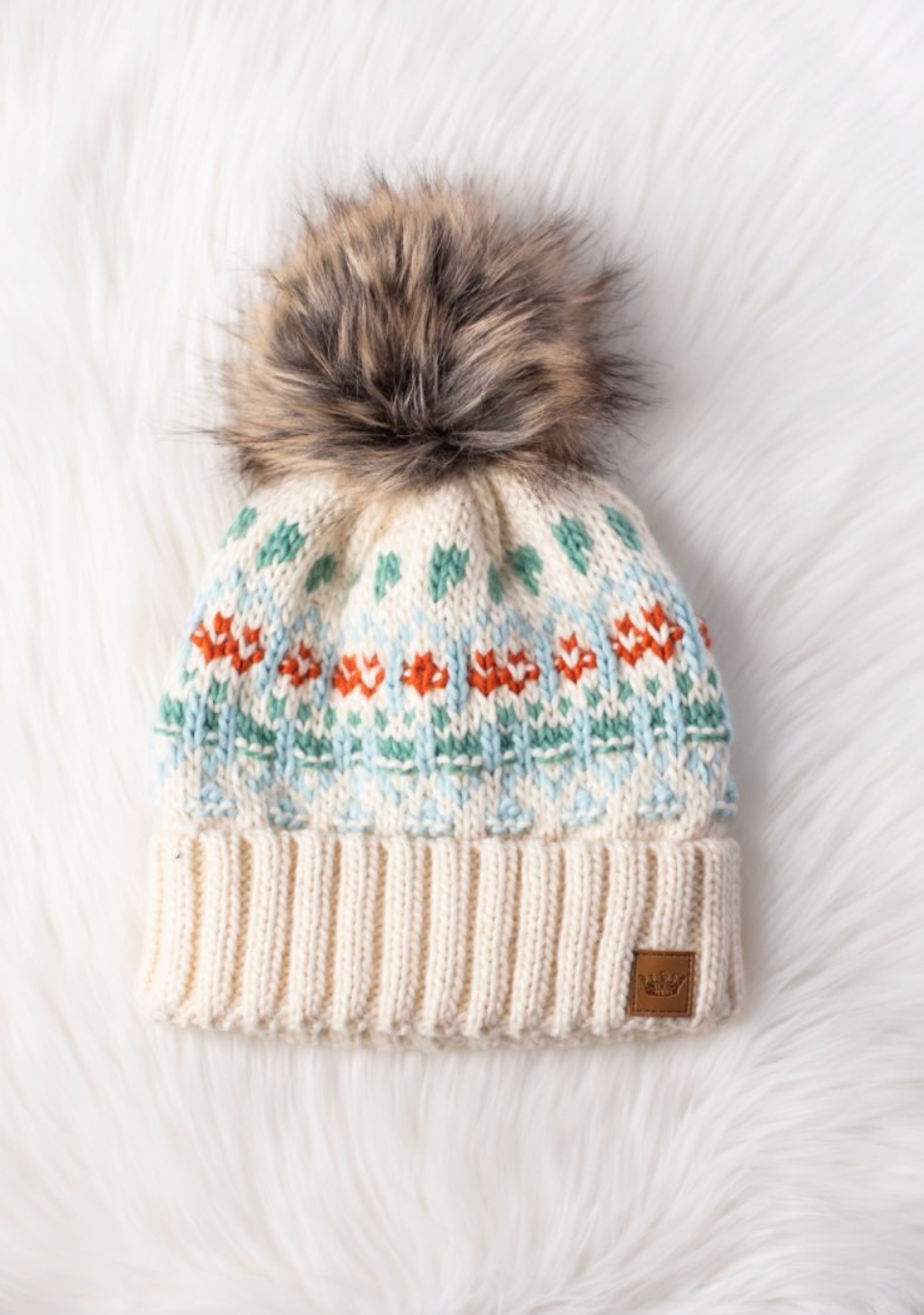 ivory, blue, green + orange pom beanie